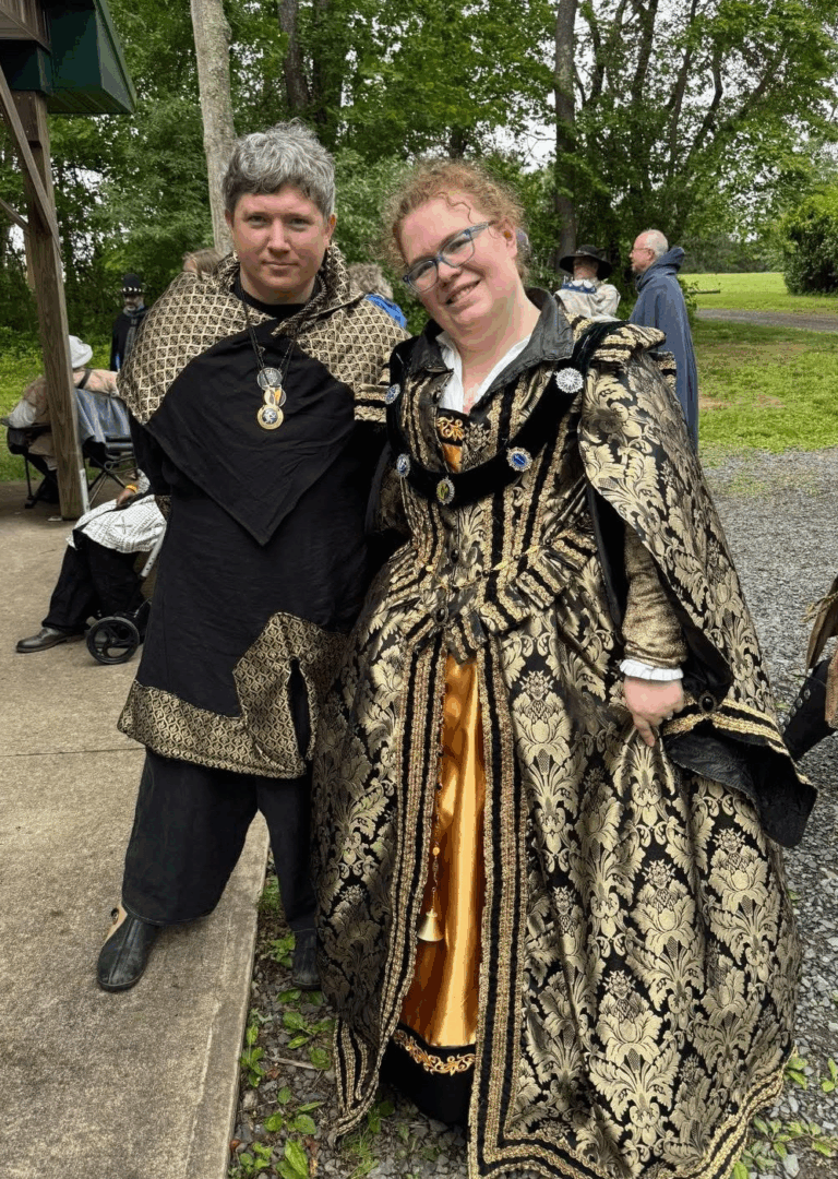 Their Excellencies Ciaran and Ellynor in garb at an outdoor event